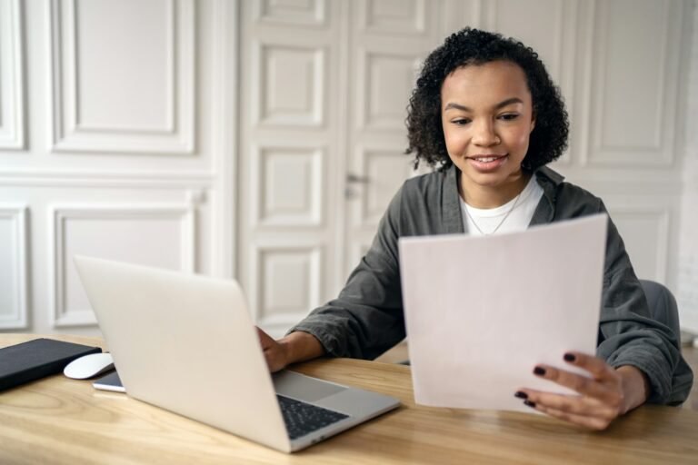 An employee of the monthly report and analytics working day in the office, a young woman startup on